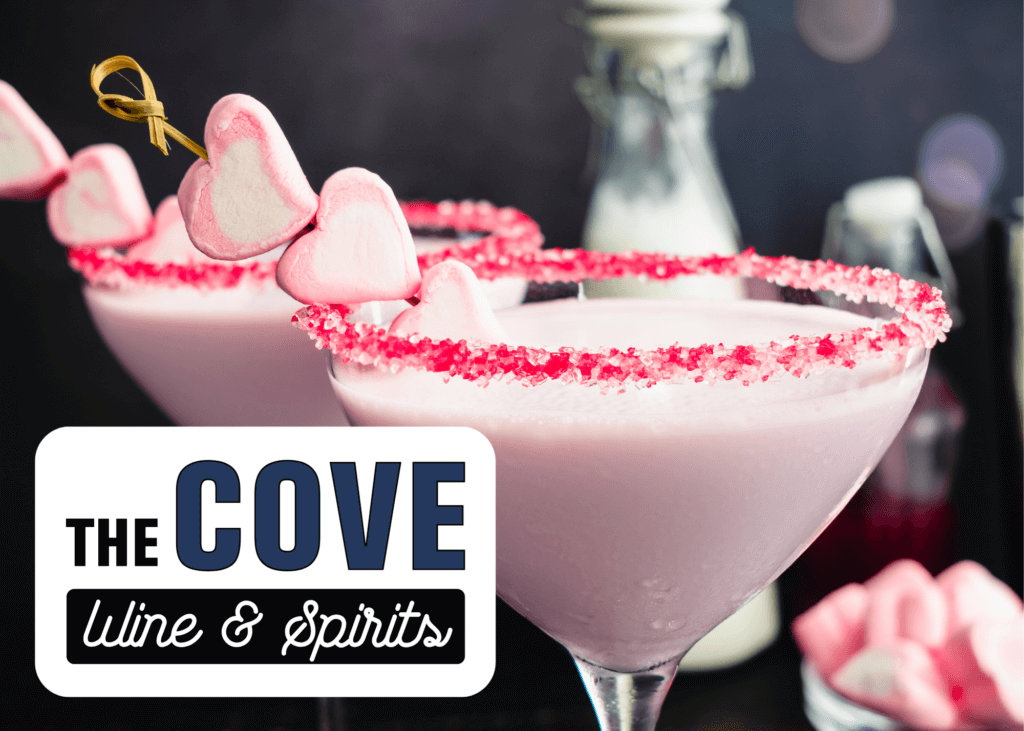 Pink martini glasses with red sugar rim and a heart skewer with The Cove Wine & Spirits logo